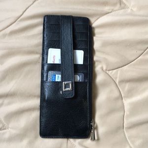 Lodis wallet new. Never used.  8 card slots. Zips